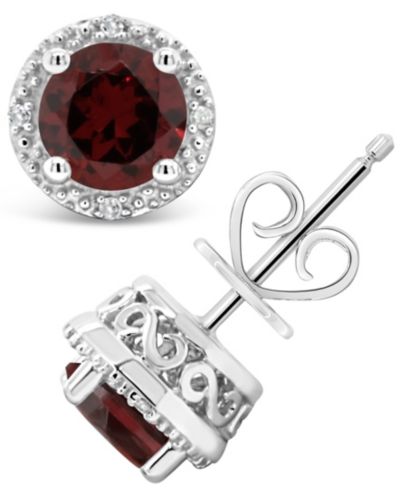 Серьги-гвоздики с белым топазом и бриллиантами в серебре