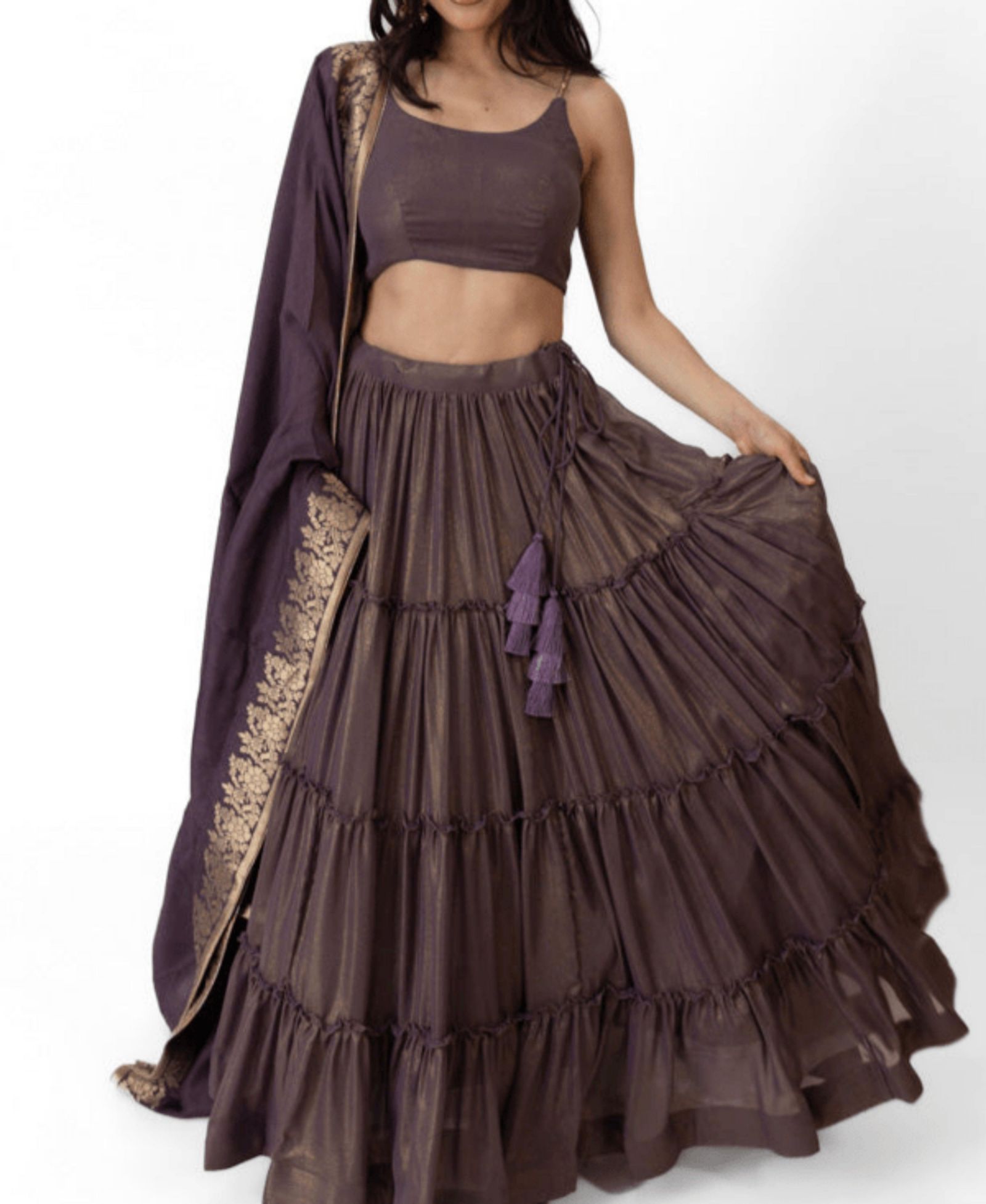 RAAS Women's Brownish Purple Shimmer Tiered Lehenga Choli with Golden Accents