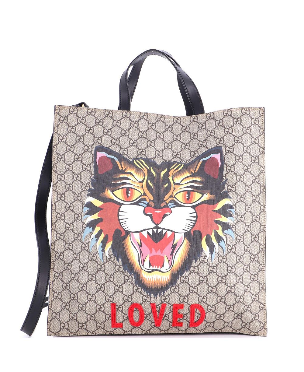 Gucci большая конвертируемая сумка-тоут для ноутбука с принтом GG из лакированной ткани